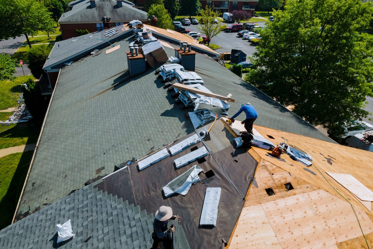 Construction worker on a renovation roof the house installed new shingles