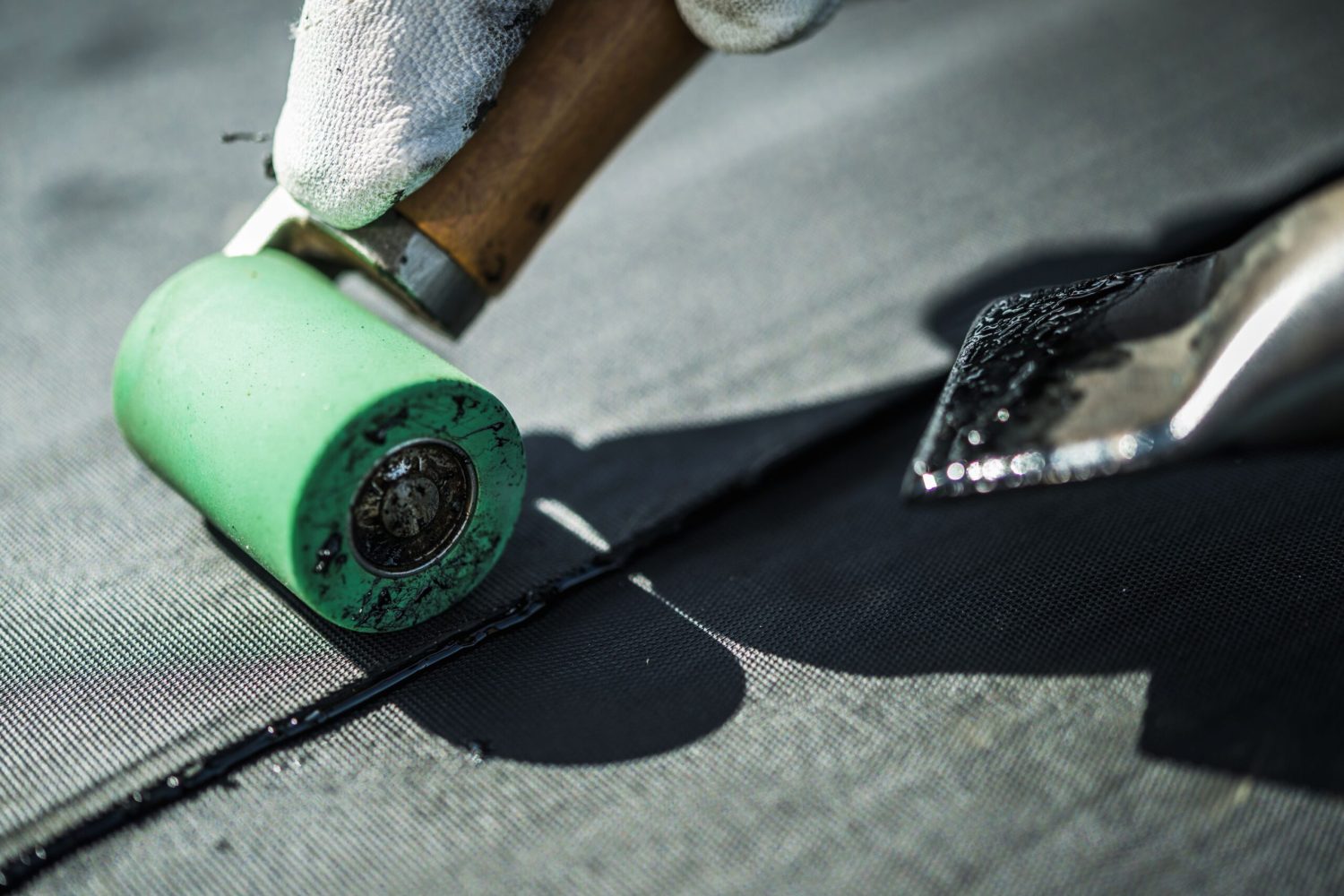 Roof Rubber EPDM Membrane Installation Close-Up. Roofing Industry Theme.